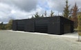 17.5mW x 9m Deep x 3.6mH with an awning, specific design clad in board and batten