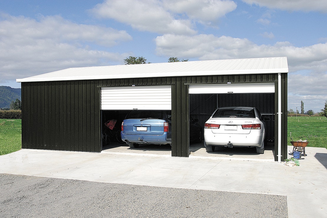 Exterior Double Door And Two Overhead Garage Doors With Balinese